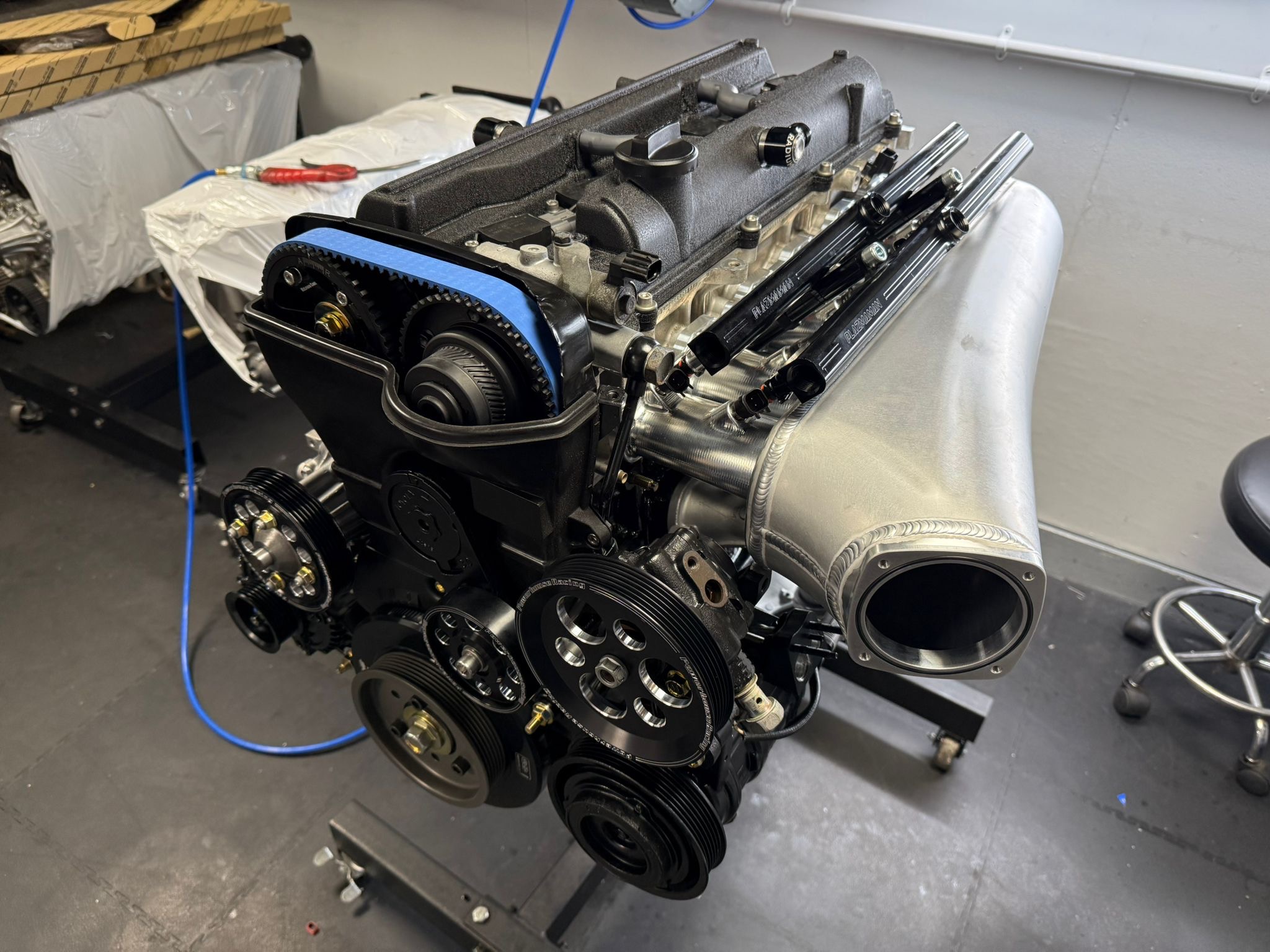 3.4 litre 2JZ-GTE on an engine stand with the Plazmaman intake manifold and both fuel rails fitted, before installation